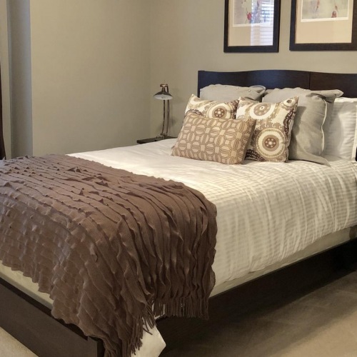 Relax and recharge in beautiful and spacious bedrooms carpeted bedroom with large window
